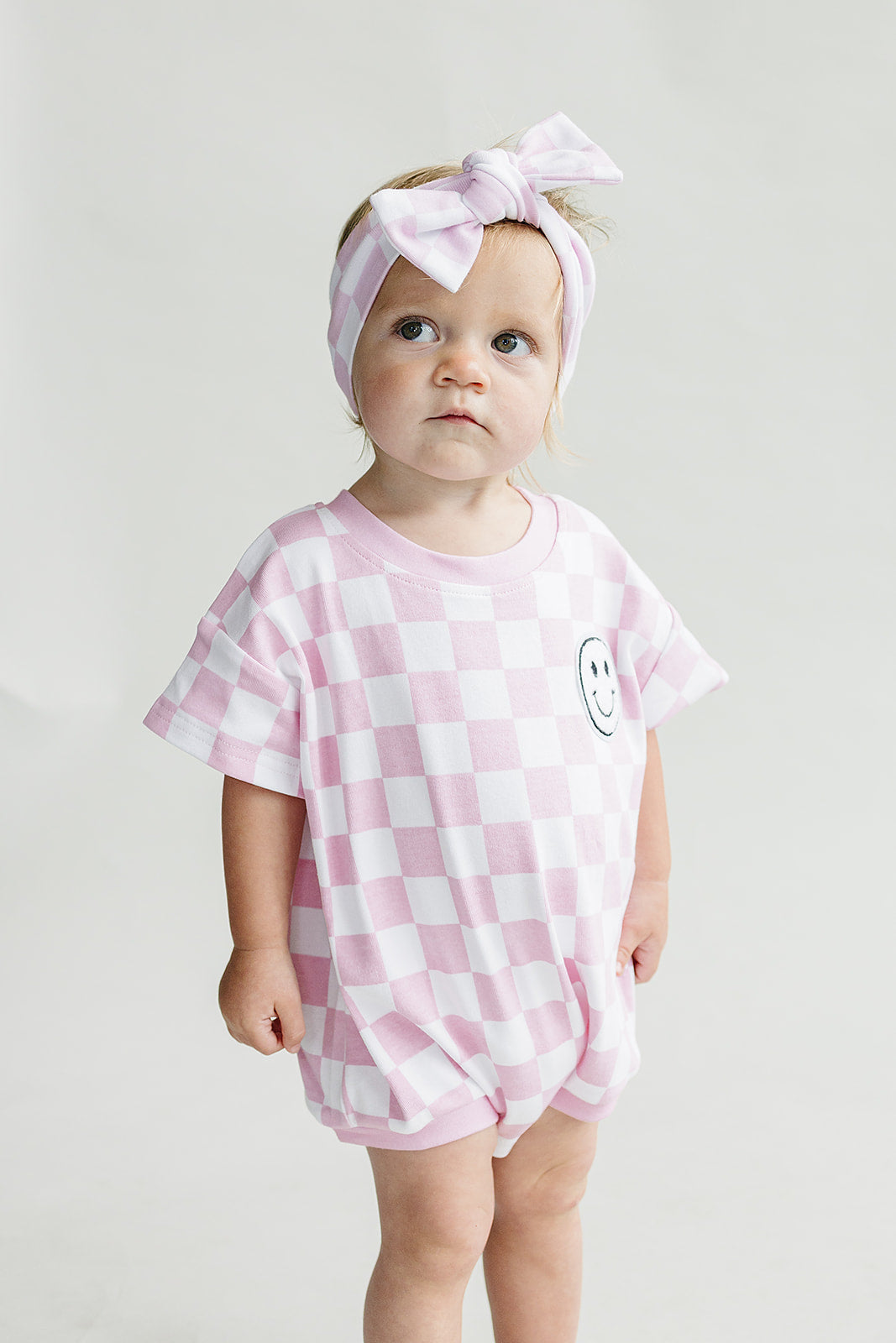 Short Sleeve Bubble Romper | Checkered Smiley Pink