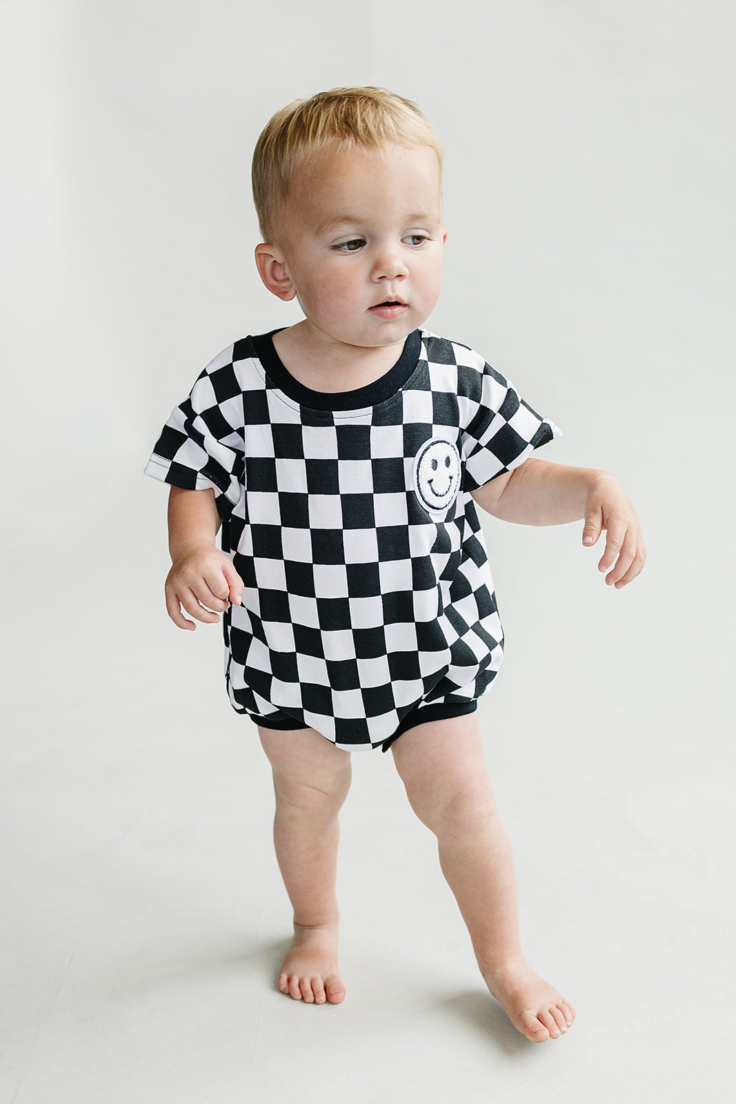 Short Sleeve Bubble Romper | Checkered Smiley Black