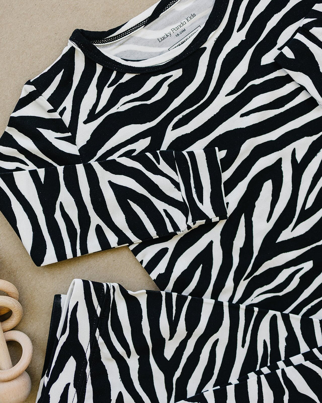 Close up of the Zebra Bamboo Two Piece Set neckline and zebra print