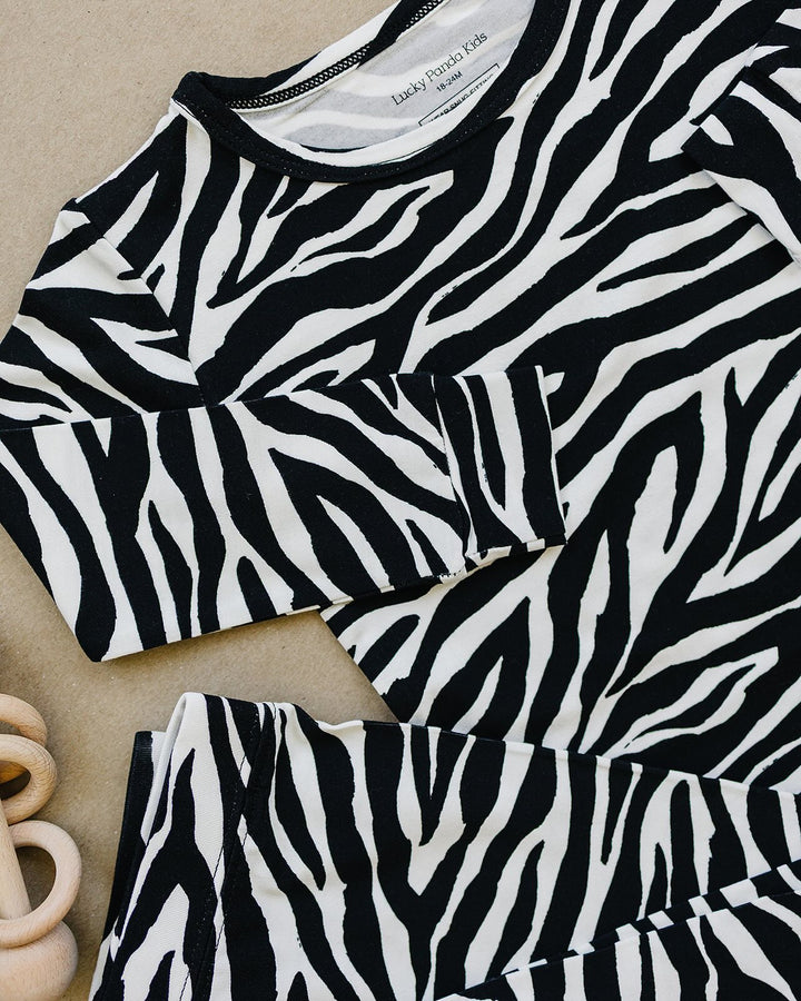 Close up of the Zebra Bamboo Two Piece Set neckline and zebra print