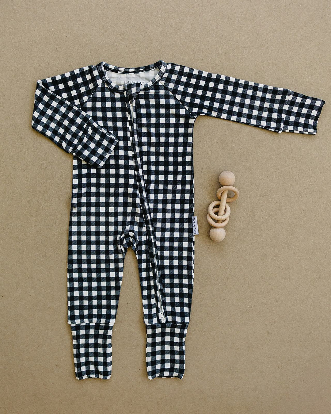Black Gingham Bamboo Zip Romper flat lay showing the full one piece design