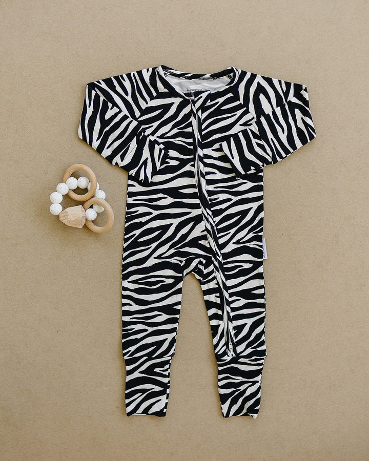 Zebra Bamboo Zip Romper flat lay showing the full one piece design