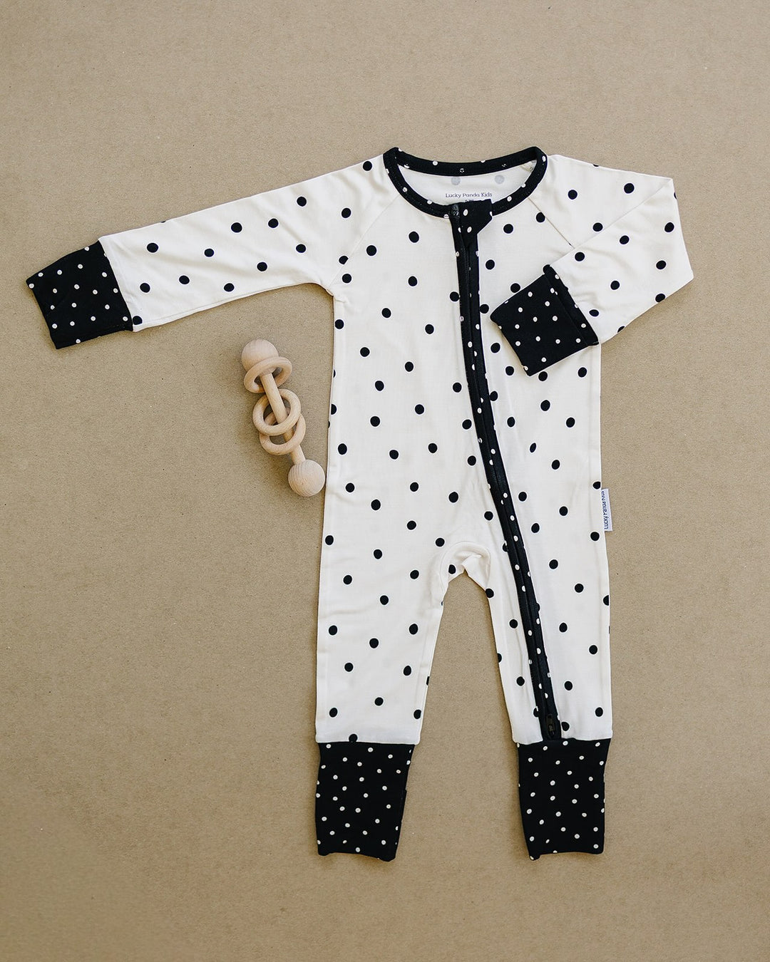 Classic Polka Bamboo Zip Romper flat lay showing the full one piece design