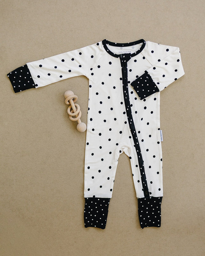 Classic Polka Bamboo Zip Romper flat lay showing the full one piece design