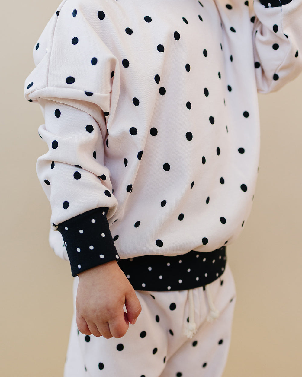 Close up of the Classic Polka Jogger Set showing the polka dot print and black trim