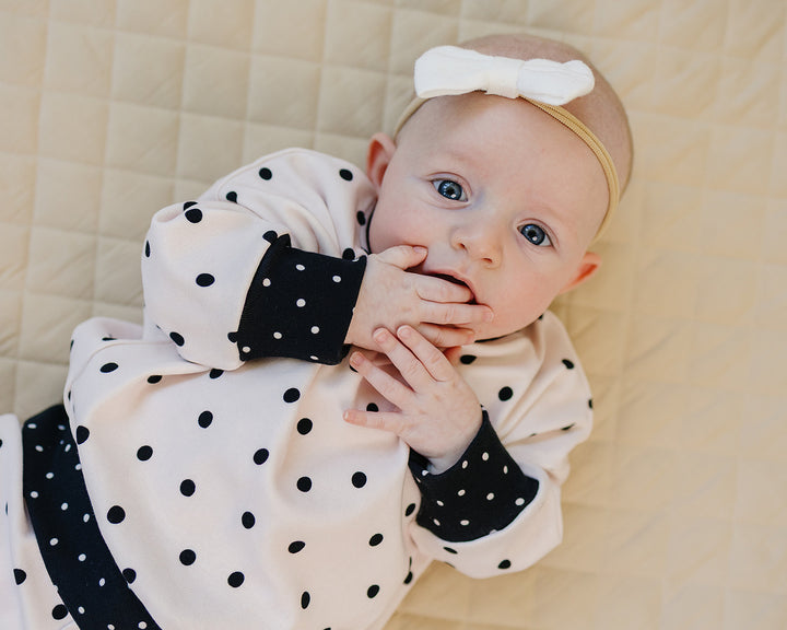 Close up of baby wearing the Classic Polka Jogger Set