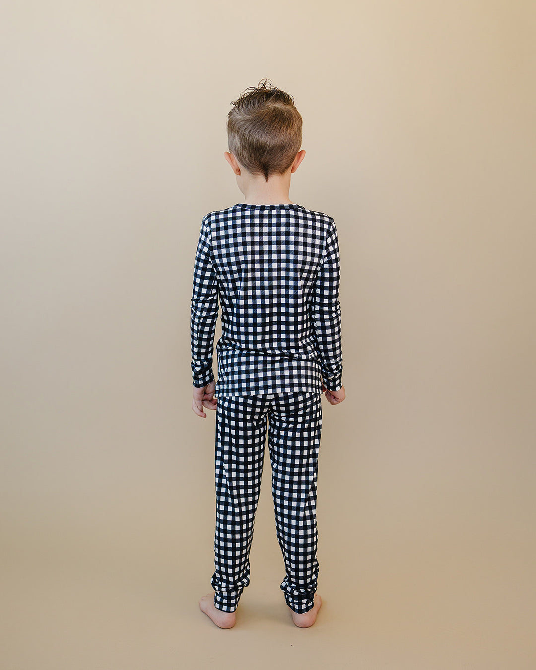 Back view of child wearing the Black Gingham Bamboo Two Piece Set