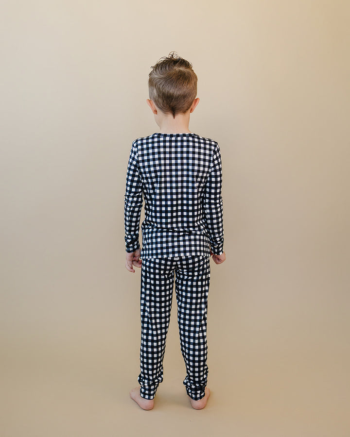 Back view of child wearing the Black Gingham Bamboo Two Piece Set