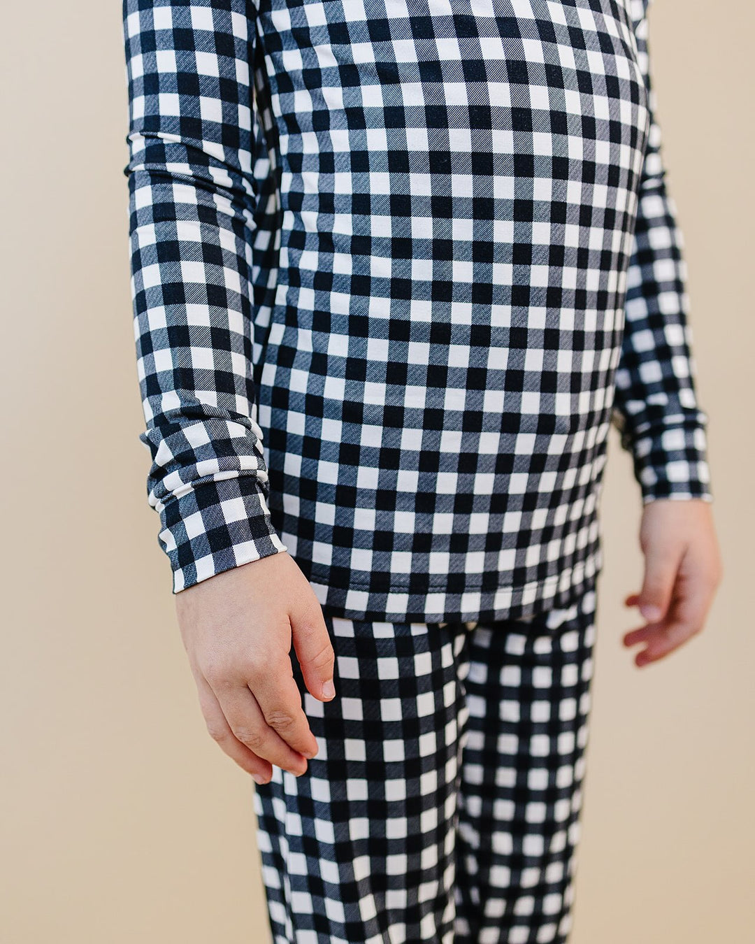 Close up of child wearing the Black Gingham Bamboo Two Piece Set with matching pants