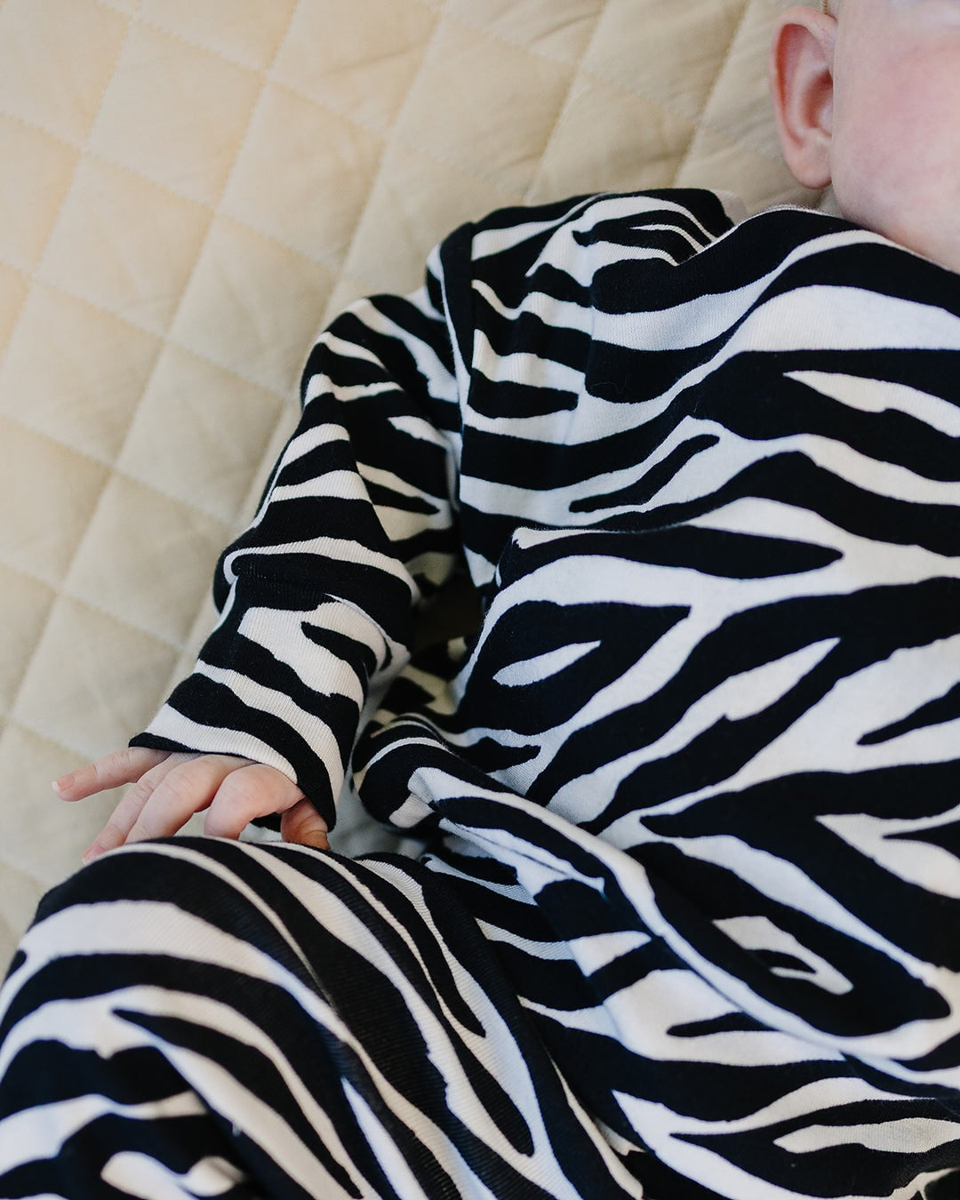 Close up of little one wearing the Zebra Jogger Set
