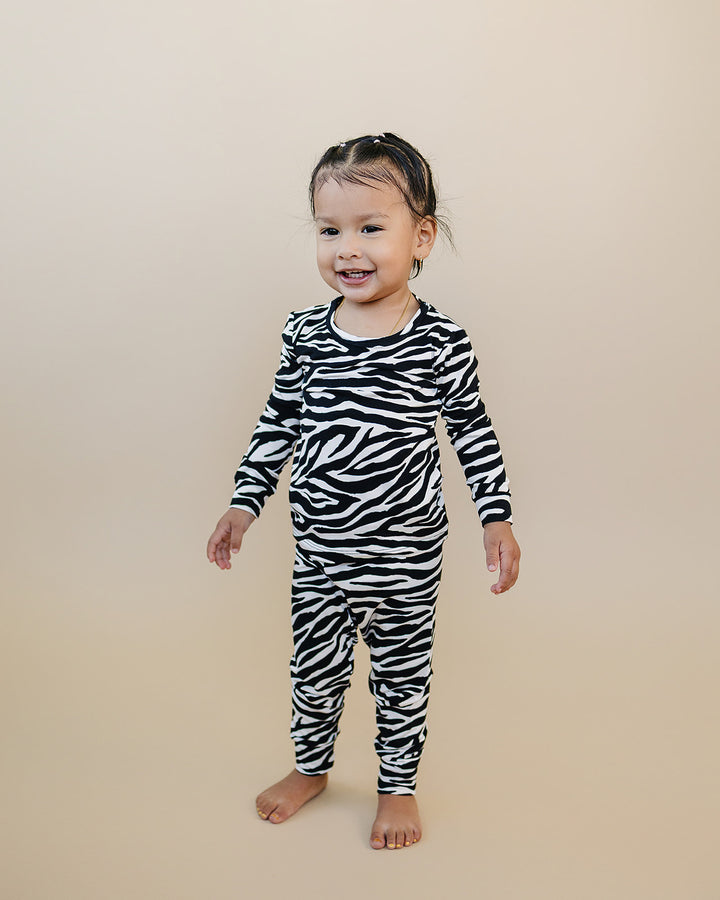Full length view of little one wearing the Zebra Bamboo Two Piece Set