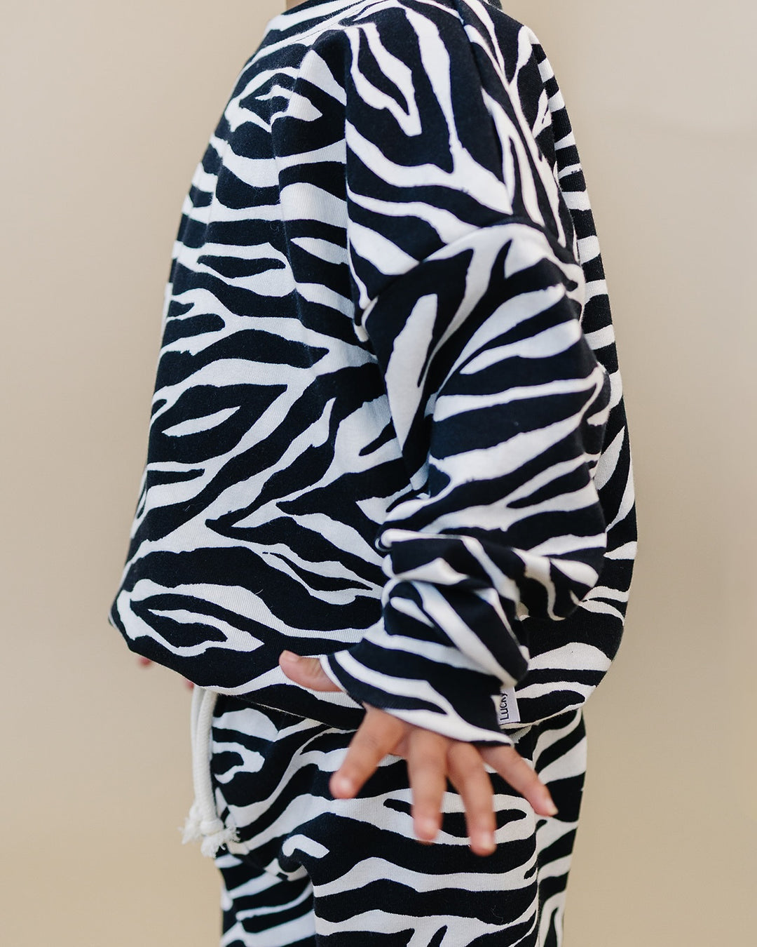 Close up of the Zebra Jogger Set showing the sleeve and zebra print