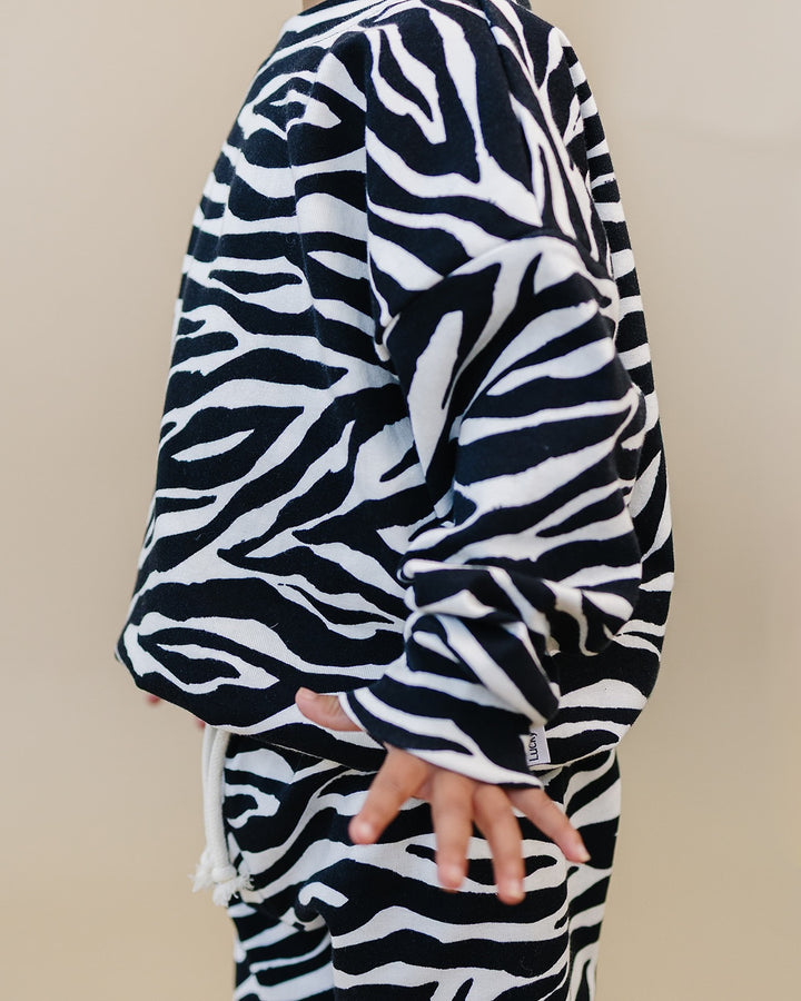 Close up of the Zebra Jogger Set showing the sleeve and zebra print
