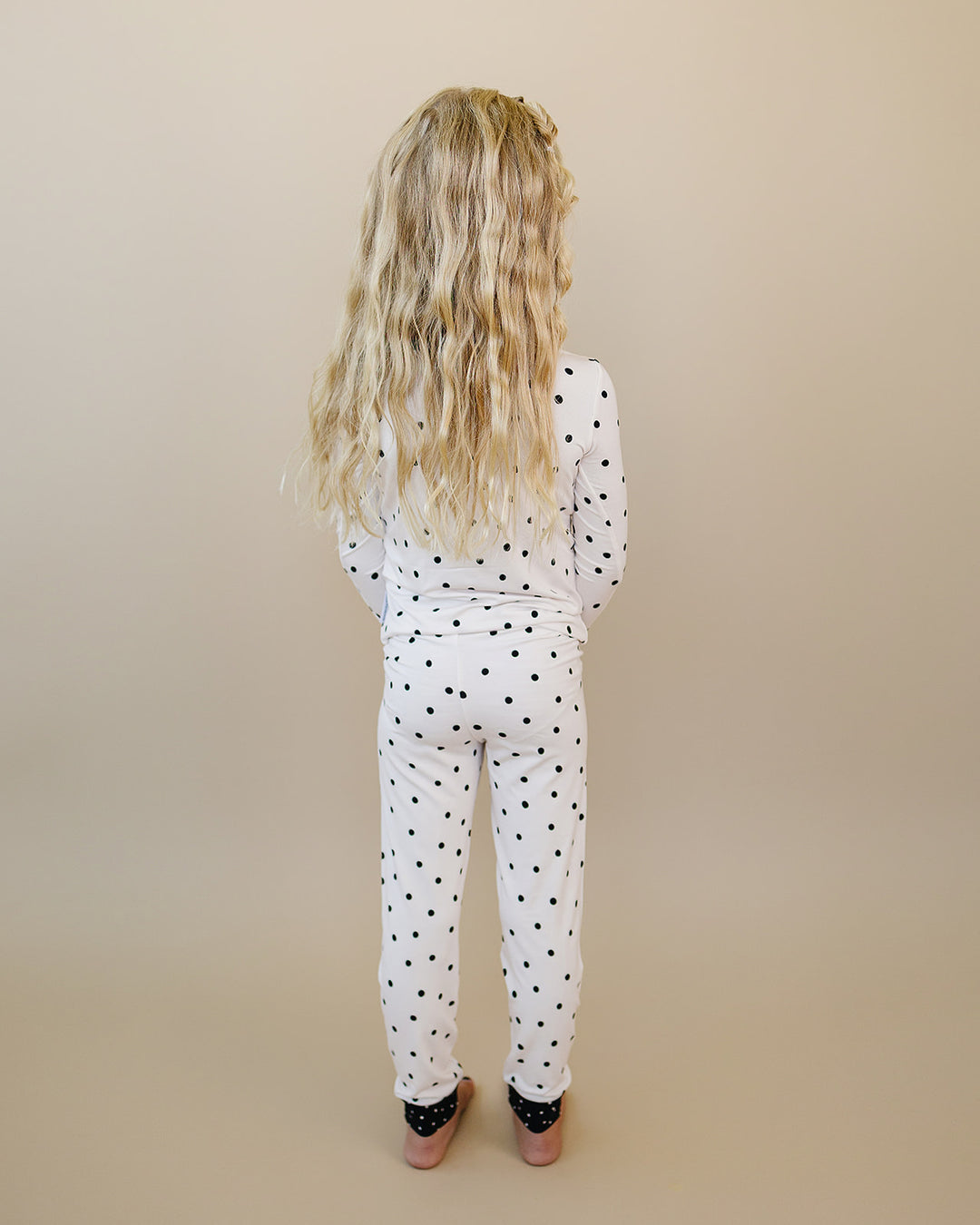 Back view of little one wearing the Classic Polka Bamboo Two Piece Set
