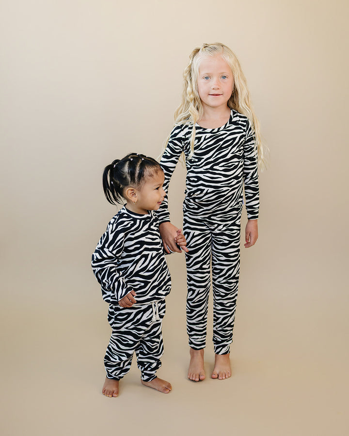 Two little ones wearing coordinating Zebra Bamboo Two Piece Sets