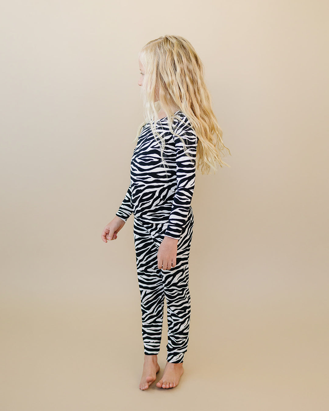 Side profile of little one wearing the Zebra Bamboo Two Piece Set