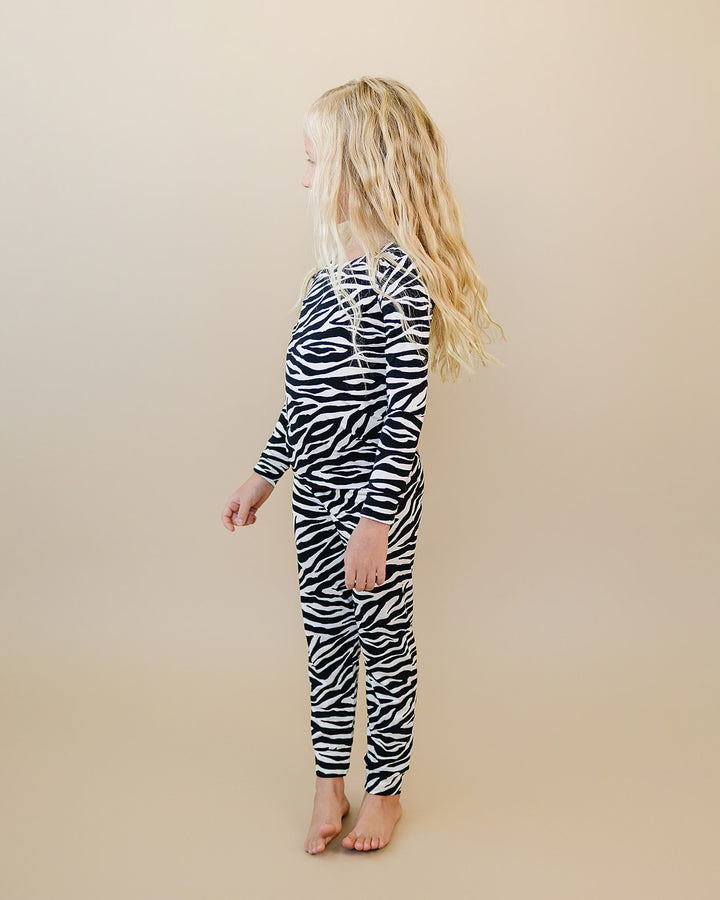 Side profile of little one wearing the Zebra Bamboo Two Piece Set