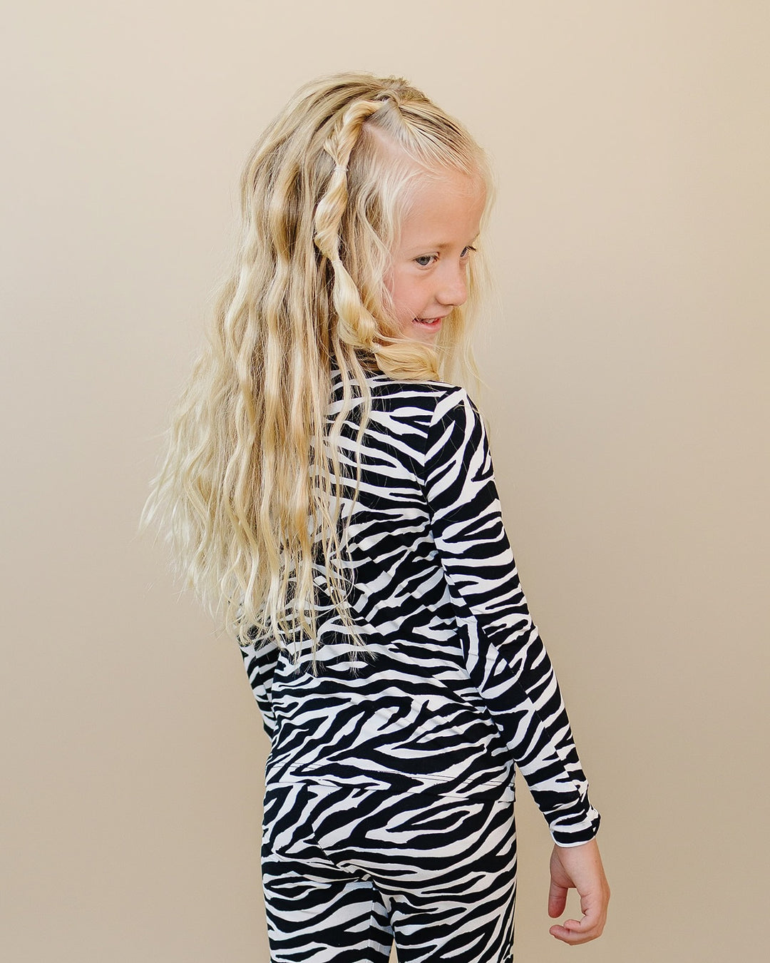 Side view of little one wearing the Zebra Bamboo Two Piece Set