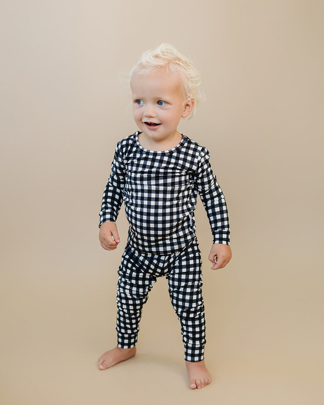 Little one standing in the Black Gingham Bamboo Two Piece Set