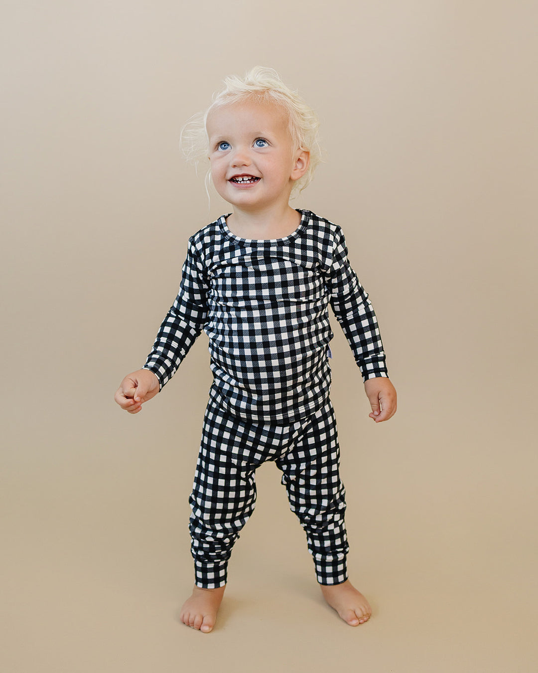 Little one wearing the Black Gingham Bamboo Two Piece Set in a relaxed everyday look