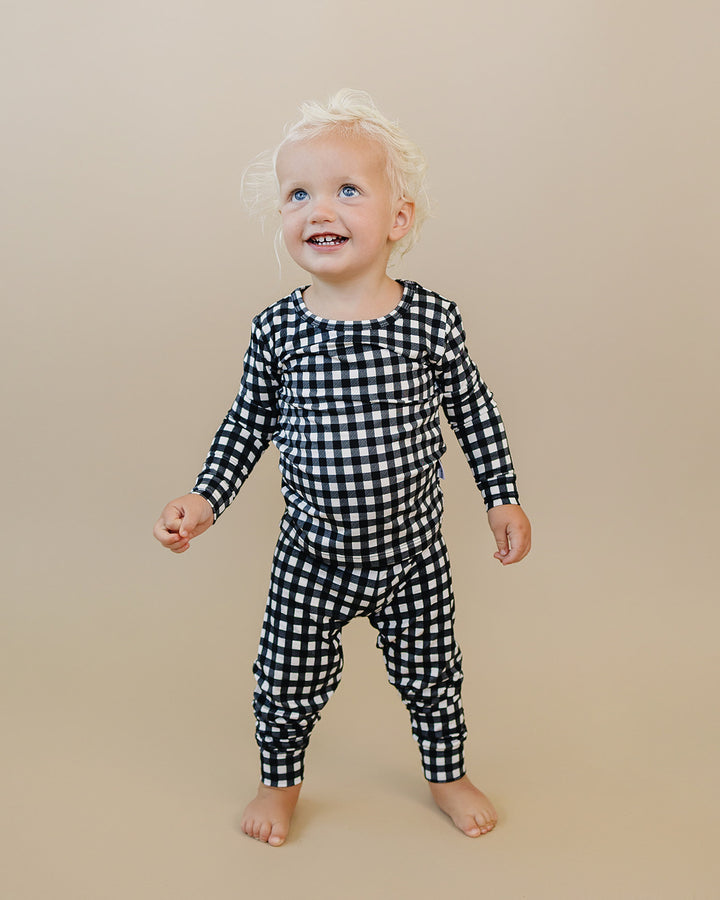 Little one wearing the Black Gingham Bamboo Two Piece Set in a relaxed everyday look