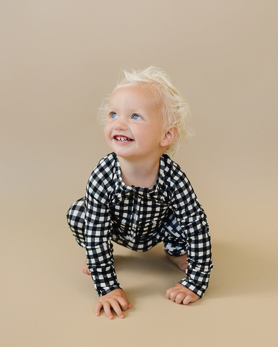 Little one crawling in the Black Gingham Bamboo Zip Romper