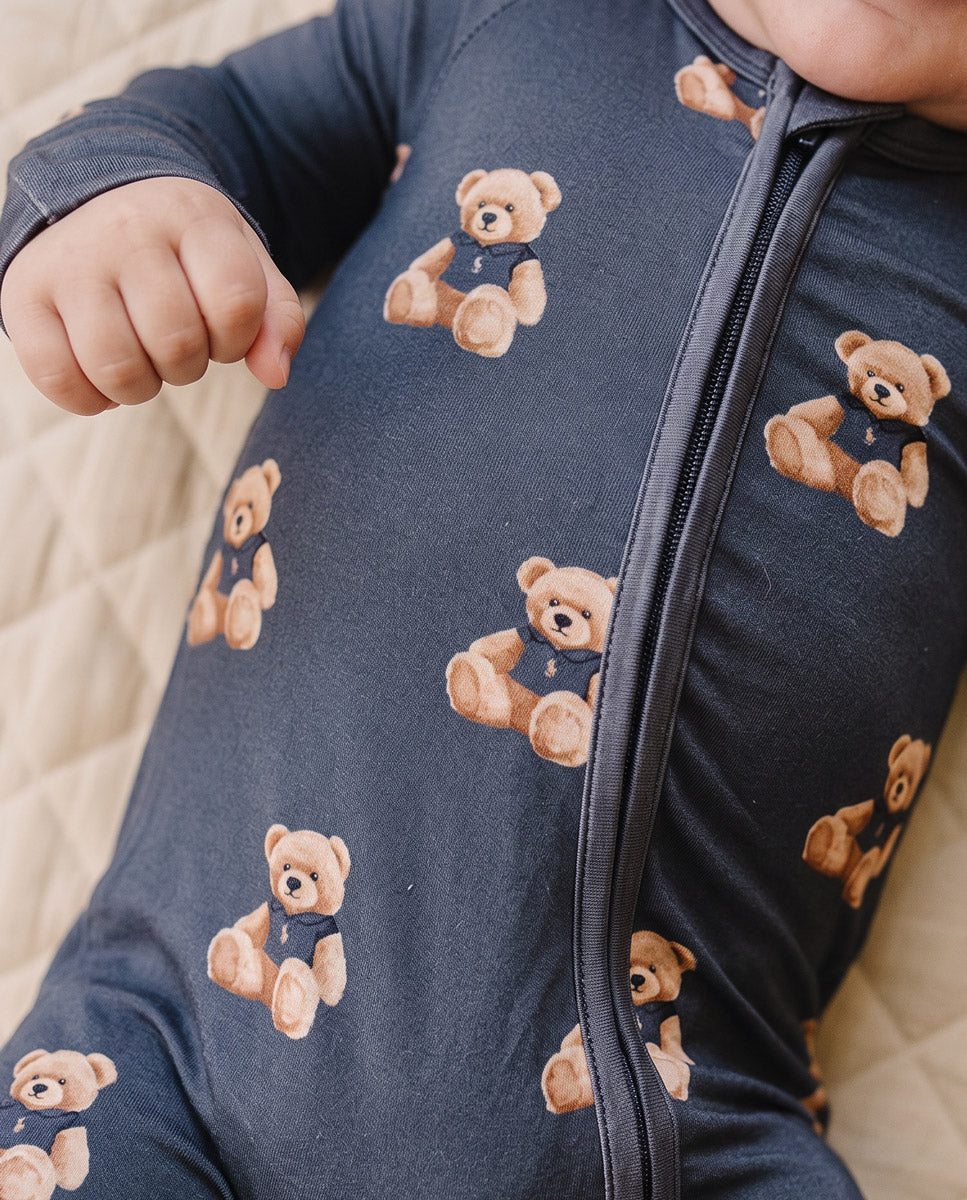 Close-up of the two-way zipper and teddy bear print on the Bear Vibes bamboo romper.
