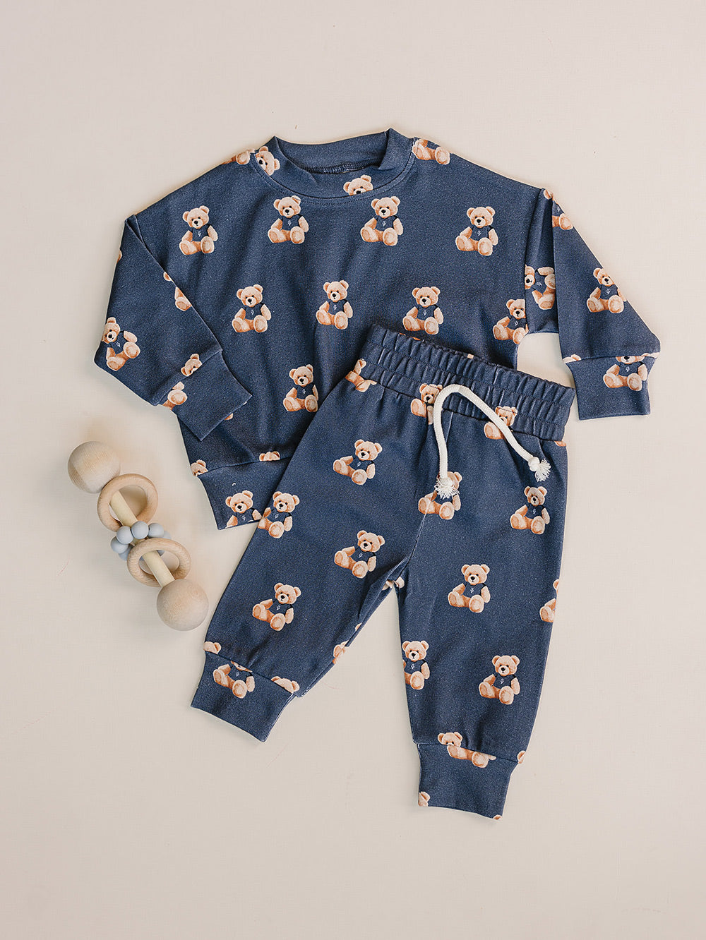 Dark charcoal Bear Vibes crewneck top and matching jogger pants displayed as a flat lay.