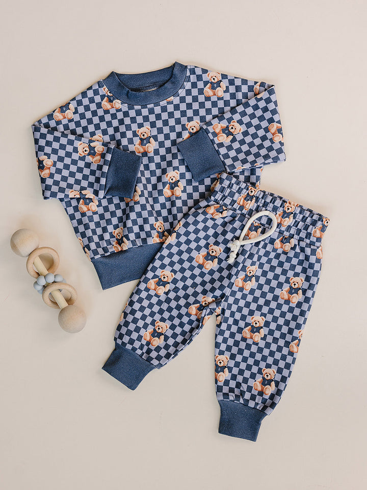 Checkered Bear Vibes long-sleeve top and matching jogger pants displayed as a flat lay.