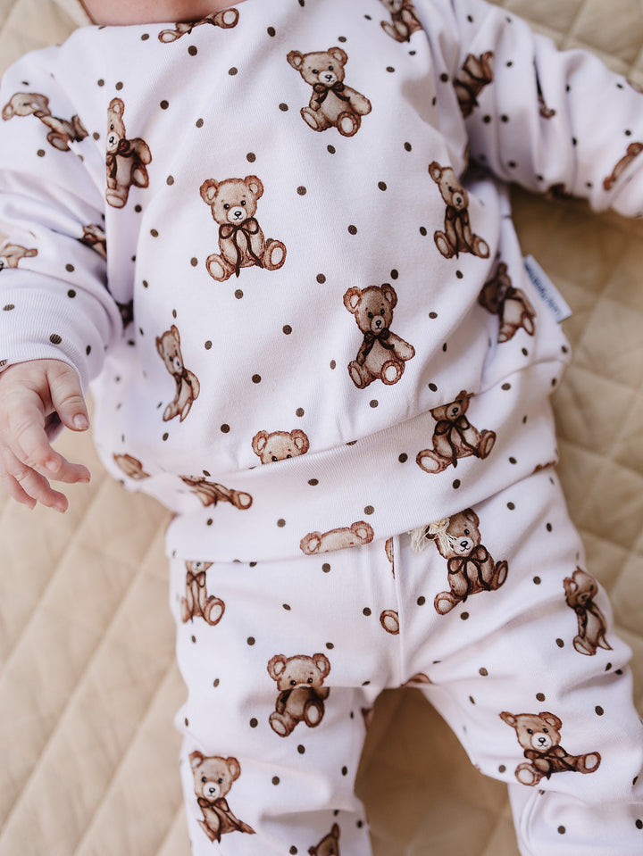 Close-up of the teddy bear print and faux drawstring waist on the Cute Bear joggers.
