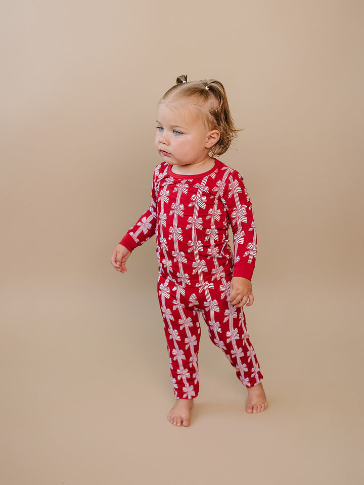  Red Bows Bamboo Two Piece — toddler girl in red bow-print Christmas pajama set, Lucky Panda Kids
