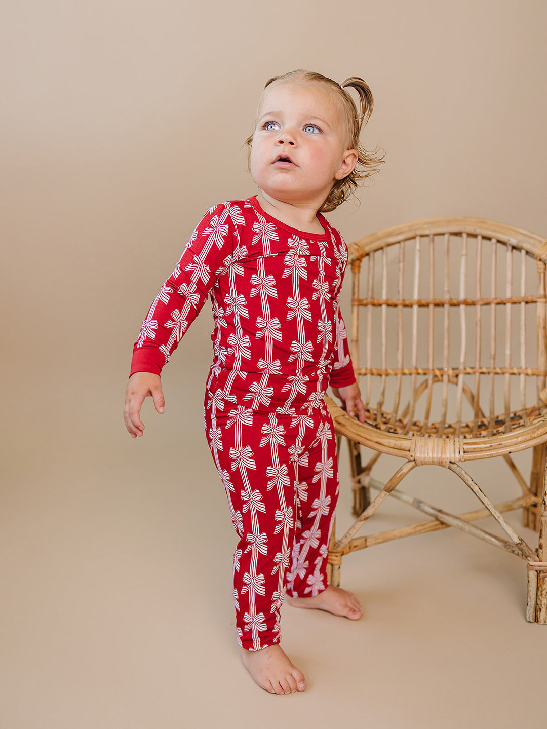  Red Bows Bamboo Two Piece — toddler girl in red bow-print Christmas pajama set, Lucky Panda Kids
