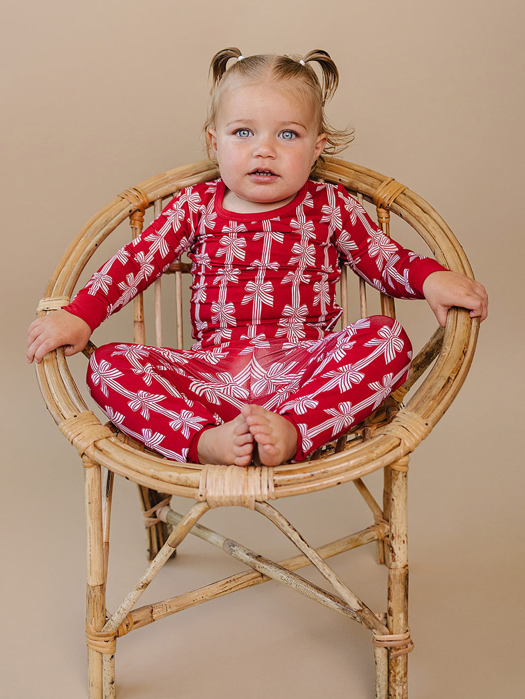  Red Bows Bamboo Two Piece — toddler girl in red bow-print Christmas pajama set, Lucky Panda Kids
