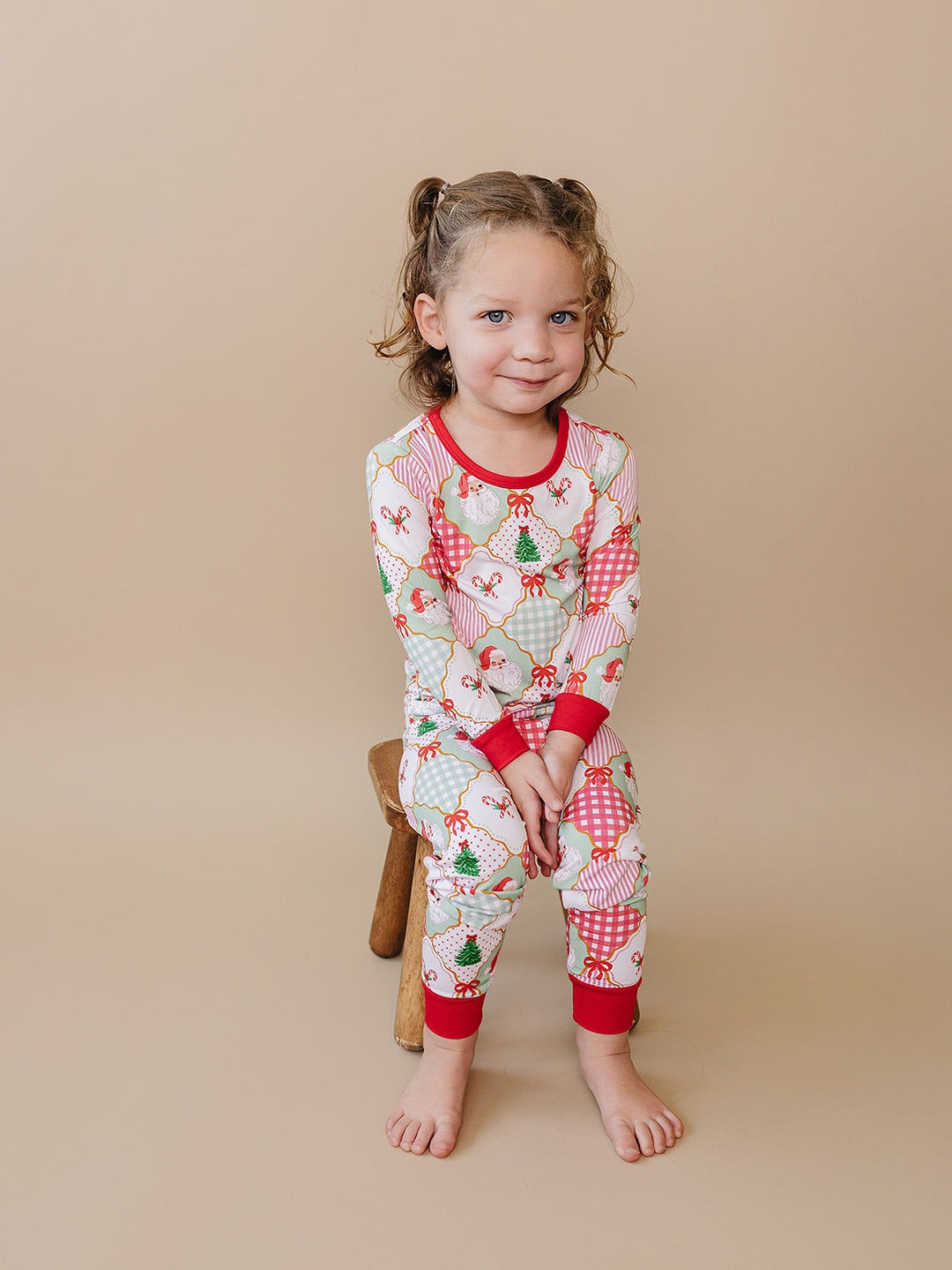 Santa Patchwork Bamboo Two Piece — toddler girl in ornament patchwork Christmas pajama set, Lucky Panda Kids

