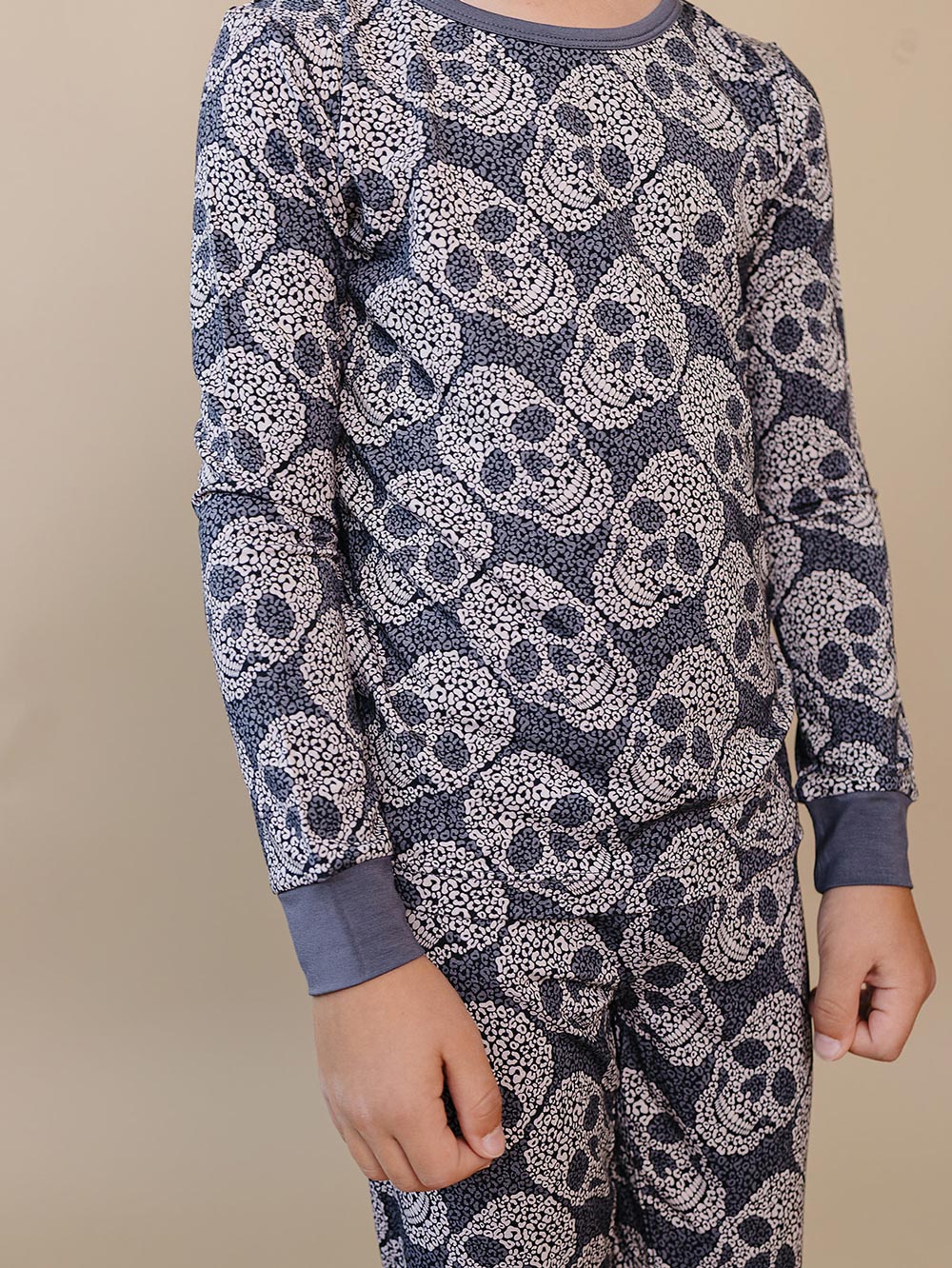 Close-up of the grey leopard skull print and sleeve detail on the bamboo pajama top.