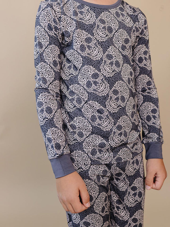 Close-up of the grey leopard skull print and sleeve detail on the bamboo pajama top.