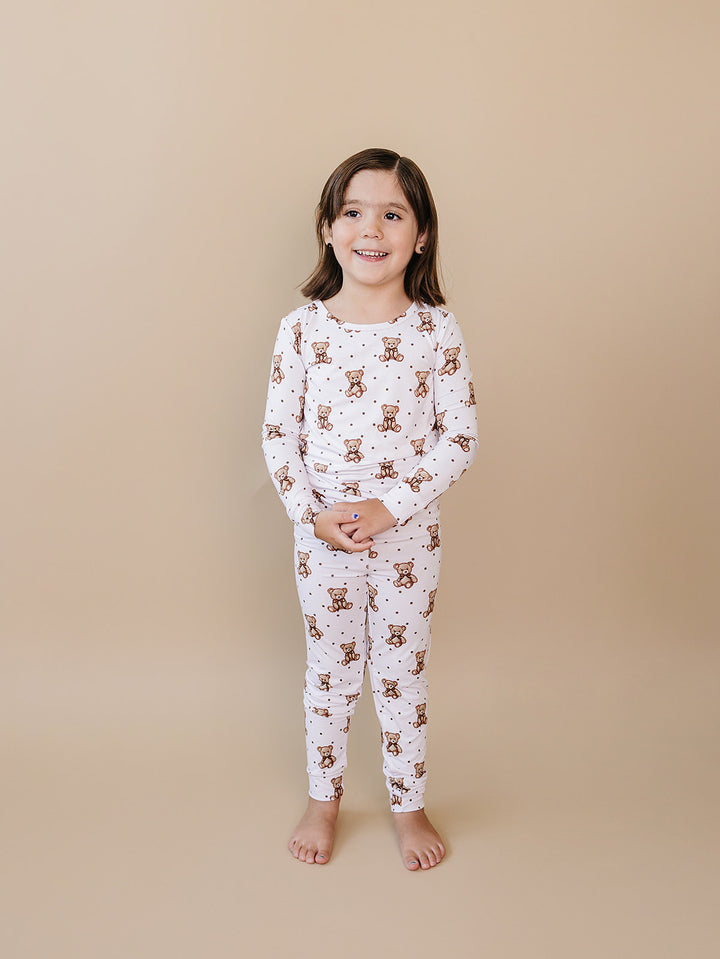 Full-length front view of a child wearing the Cute Bear bamboo two-piece outfit.