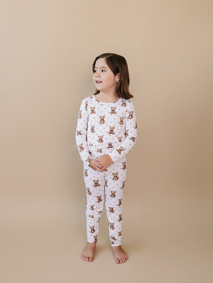 Side view of a child wearing the Cute Bear bamboo pajama set.