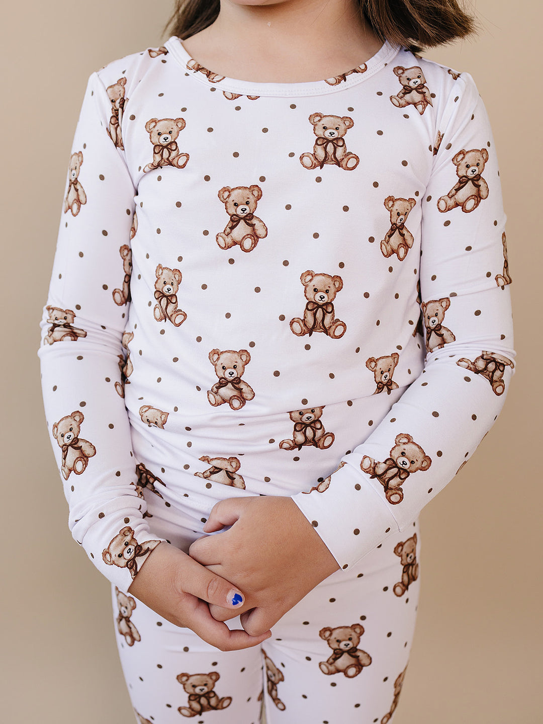 Close-up of the teddy bear and polka-dot print on the Cute Bear bamboo top.