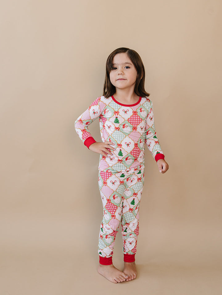Santa Patchwork Bamboo Two Piece — toddler girl in ornament patchwork Christmas pajama set, Lucky Panda Kids
