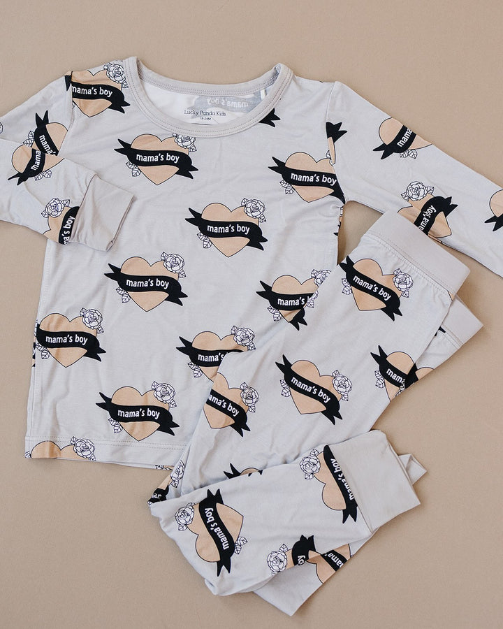 Mama’s Boy bamboo long-sleeve top and matching pants with heart-and-banner print displayed flat.