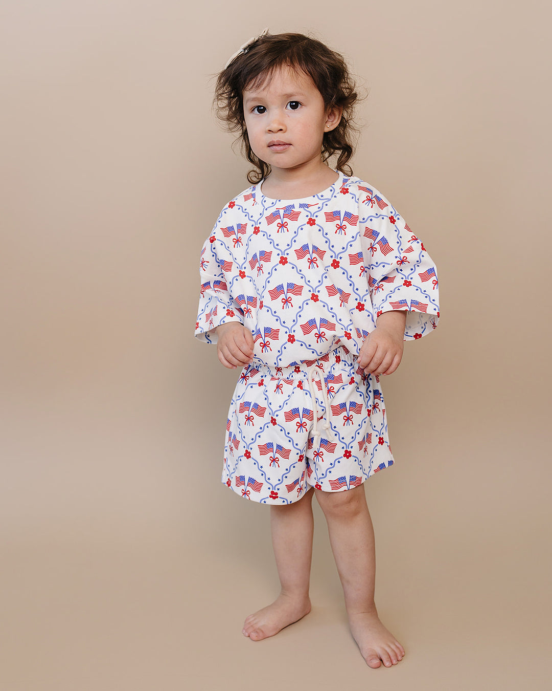 Toddler girl in Lucky Panda Kids 4th of July cotton shorts set, American Girl design — relaxed fit top with faux drawstring