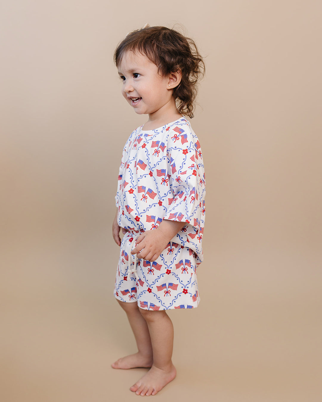 Toddler girl in Lucky Panda Kids 4th of July cotton shorts set, American Girl design — relaxed fit top with faux drawstring