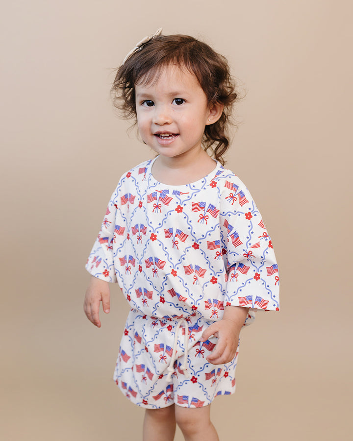 Toddler girl in Lucky Panda Kids 4th of July cotton shorts set, American Girl design — relaxed fit top with faux drawstring