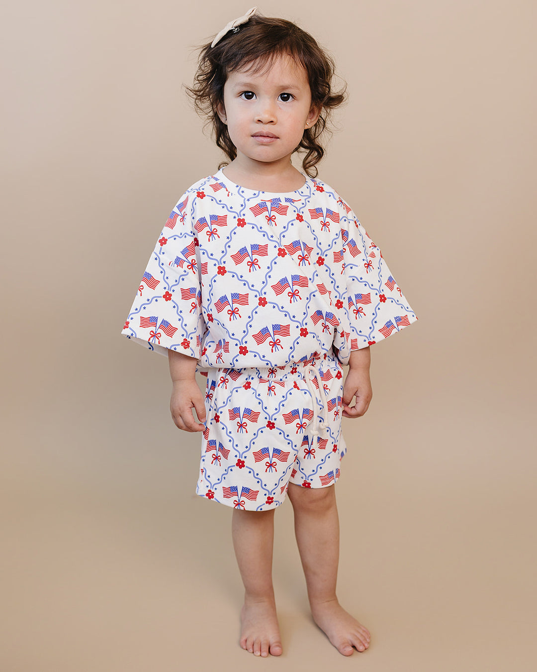 Toddler girl in Lucky Panda Kids 4th of July cotton shorts set, American Girl design — relaxed fit top with faux drawstring