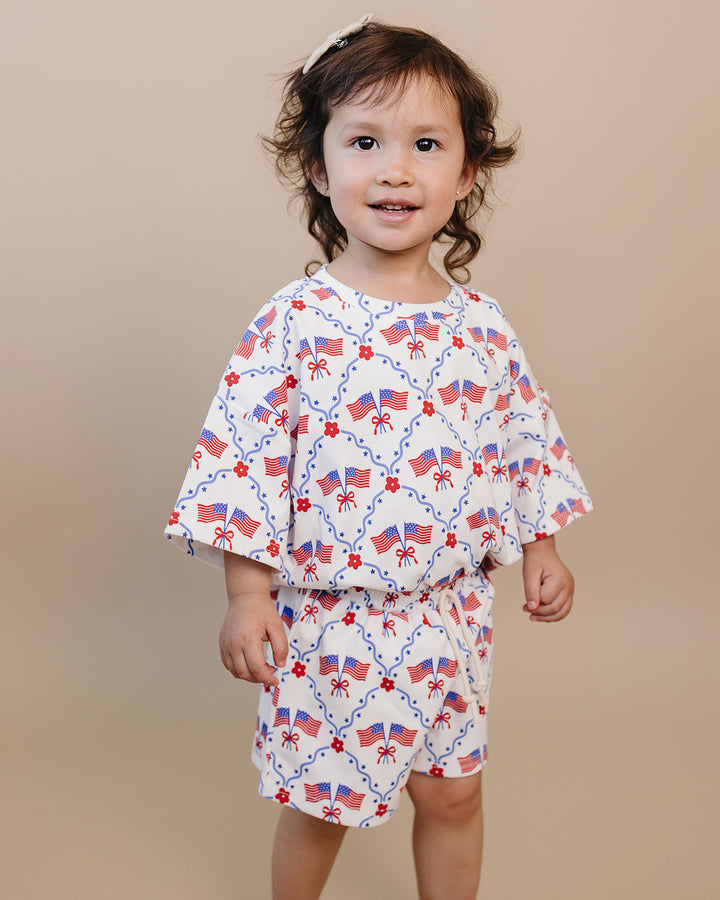 Toddler girl in Lucky Panda Kids 4th of July cotton shorts set, American Girl design — relaxed fit top with faux drawstring