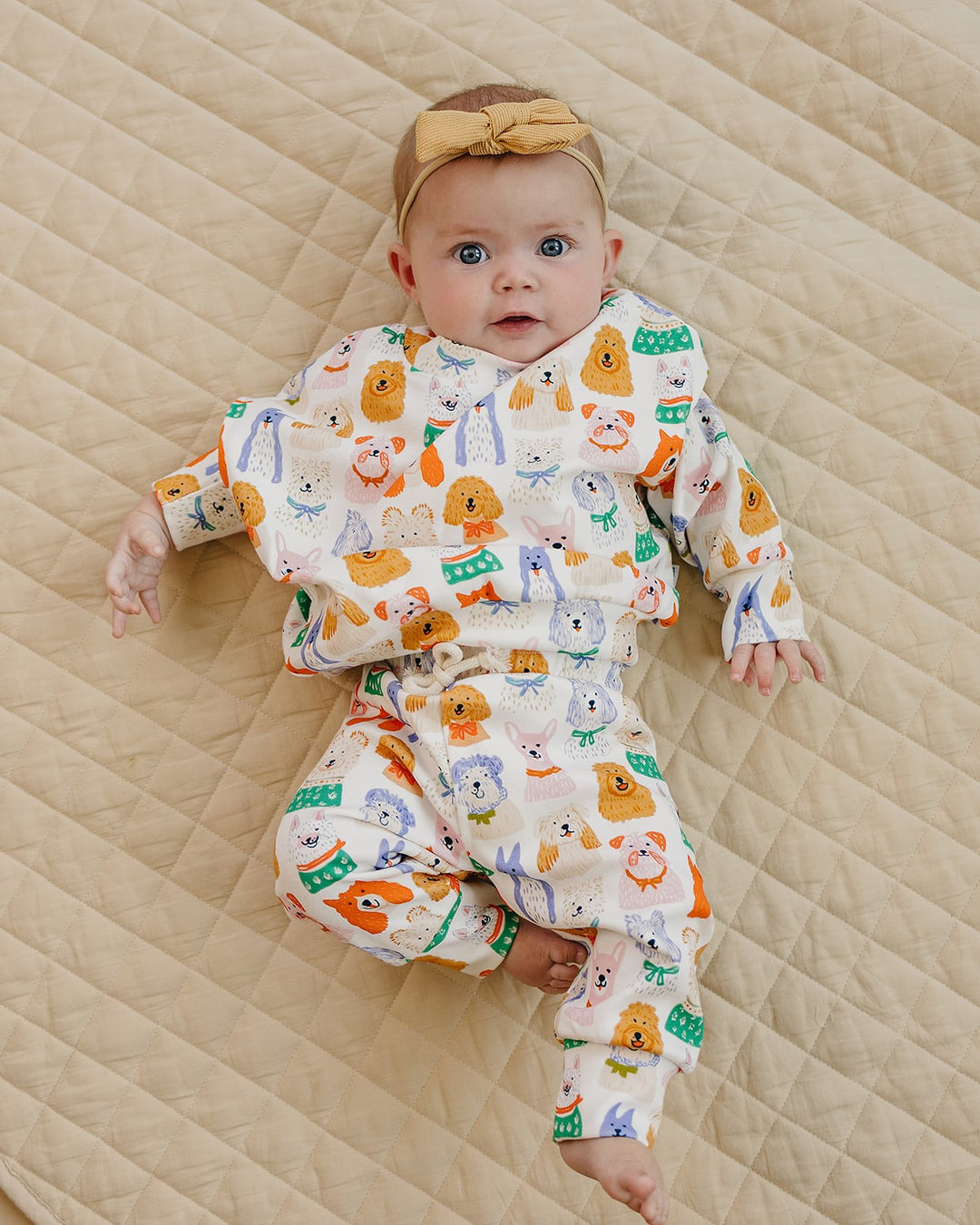 Puppy Club cotton top and matching joggers with colorful dog illustrations on a white background displayed flat.