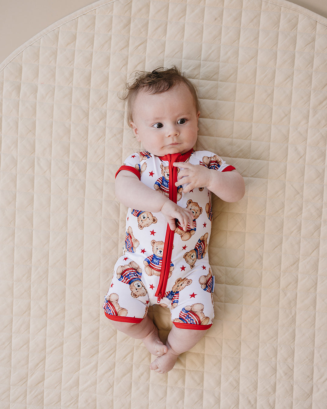 Baby boy wearing Lucky Panda Kids Bamboo Shorty Romper American Bear — patriotic 4th of July baby boy outfit