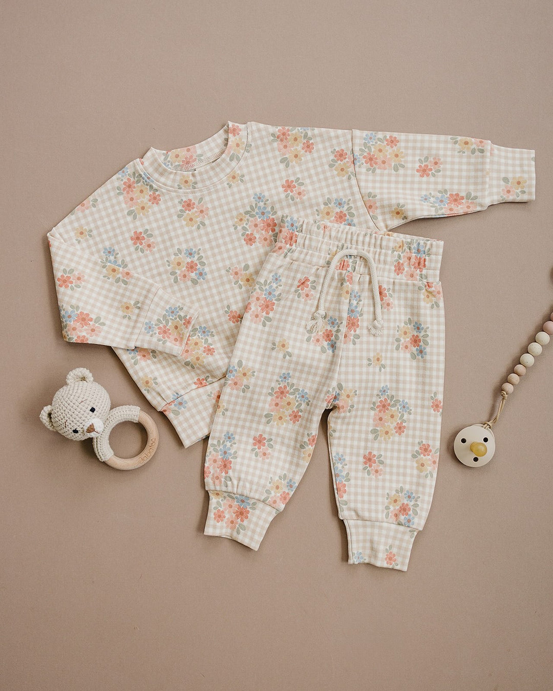 Toddler modeling the Lucky Panda Kids Wild Flower cotton jogger set in a full-length studio view.