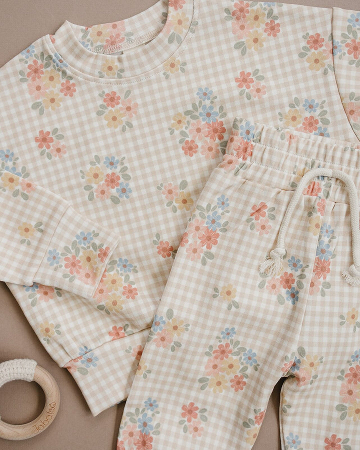 Close-up of the Wild Flower cotton jogger set, showing the floral print and elastic-waist pants.